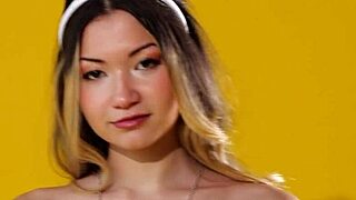 Kelly lu undresses, showing her pierced nipples for playboy