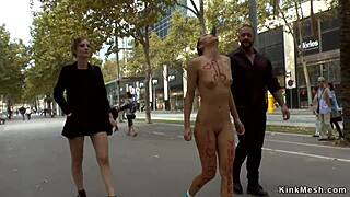 Public humiliation of a brunette slut in front of people