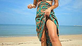 Are you ready to see this pretty babe flashing her hairy pussy under long dress on beach?