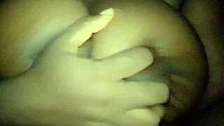 ebony babe groping her busty chest softly