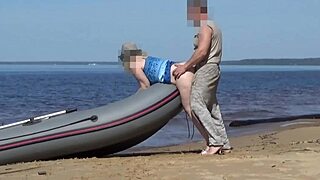 Hey, check this lady tourist with curvy ass teasing boatman on beach!