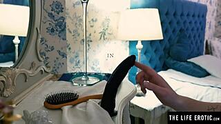 young blonde in fishnets rides her black dildo doggy style