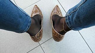 Isabelle-Sandrine's balcony show in snake skin stilettos