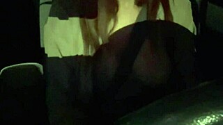 Artemisia Love flashes big tits during night car ride.