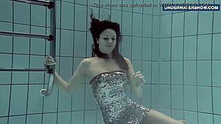 Brunette Flashes Bright Tits Underwater at Public Pool for Thrills