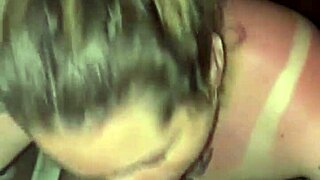 Sunburned blonde goddess with tattoos gives deepthroat blowjob in thong