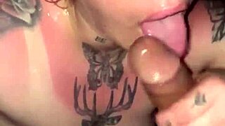 Sunburned blonde goddess with tattoos gives deepthroat blowjob in thong