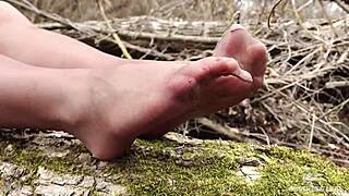 Hey, check this goddess teasing with feet in tan pantyhose outdoors