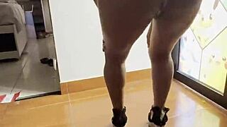 A latina woman dances, showcasing her big ass in this video.