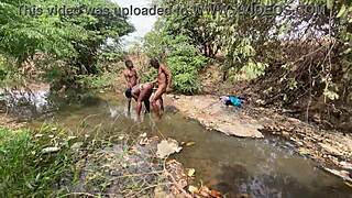 Curvy ebony babe flashes her brown skin by the stream.