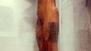 hot teen gets horny in the shower, using her toy for masturbation