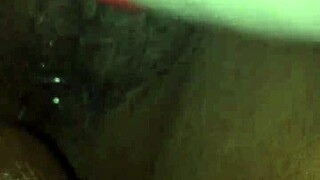 Ebony plays with wet pussy using vibrator