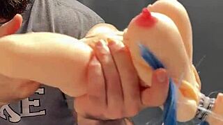 Little sex doll being played with by a big toy in bedroom