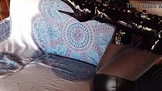 Petite amateur in total black lingerie fishnets pantyhose and over-the-knee boots shows ass