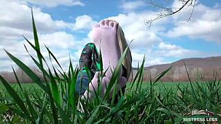 Goddess Feet In Cute White Socks With Jeans On The Spring Grass Field