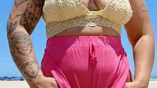 african woman flashes big pussy lips to excite her beach lover