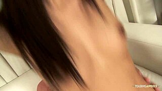 cum sprays all over young asian's chest and tits as she jerks her guy off