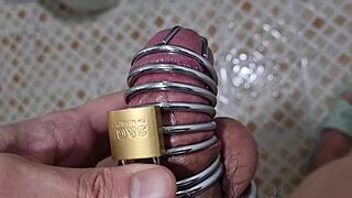 Korslaveman pees while wearing chastity belt