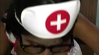 young latina nurse cares for patient in hospital