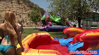 Lesbian beauties toying each other's pussies with strapon dildos outdoors. Dive into intense muff diving and licking!