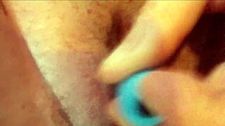 Pretty milf's tight pussy teased with vibrator in close-up