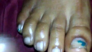 the ebony foot job unfolds with black cumshot and feet action in ebony elegance style.