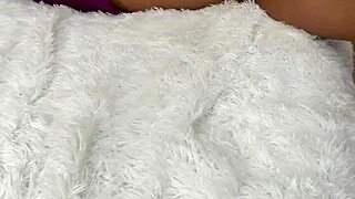 Stepmom teases by flashing her wet pussy between spread legs in homemade solo session. She builds tension with slow masturbation.