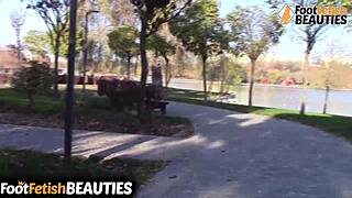 I watch brunette babe remove socks and walk barefoot in park