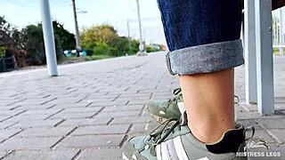 Tan Nylon Soles With Blue Jeans Teasing On The Bench Outdoors