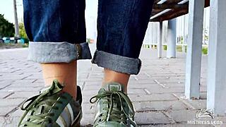 Tan Nylon Soles With Blue Jeans Teasing On The Bench Outdoors