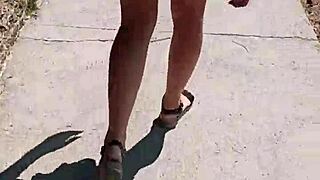 She flashes her ass publicly on the street. Milf goes fully naked outdoors in this scene.