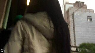 In the crowded train setting, a woman sports a casual jacket and sturdy boots during her daily commute. Part 1.