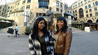 Romantic african couple shares a gentle lesbian makeout session in the shower with light fingering.