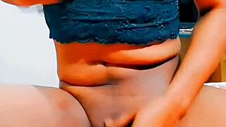 Feminine sissy in tight thong and miniskirt masturbates oiled body with small cock to orgasm