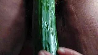 Grandma stuffs her hairy beaver with a big cucumber in wild German solo action.