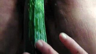 Grandma stuffs her hairy beaver with a big cucumber in wild German solo action.