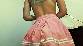 beautiful young woman in pink skirt fucked up wanting to play piano outdoors