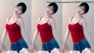 Cute chinese girl dances up and down seductively