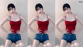 Cute chinese girl dances up and down seductively
