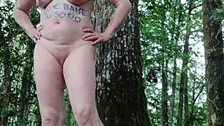 Milf slave flashes tits outdoors then bends for humiliating forest doggystyle session