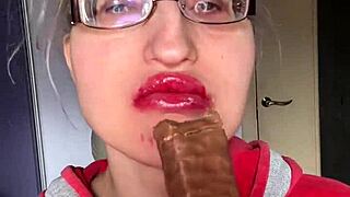 giantess with huge lips n glasses smears snickers bar... mmm so messy!