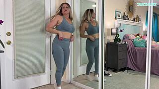 Sexy milf tries on tight gym clothes flashing her huge natural tits everywhere
