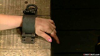 redhead lezdom slave gags on toys in bondage...