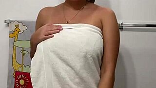 Hey, check out this prostitute stripping off her towel slowly.