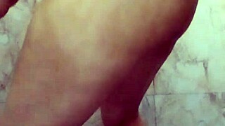Indian girl fingering in the bathroom with dirty talk in Hindi.