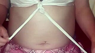 She used her vibrator while wearing sexy lingerie, reaching orgasm.