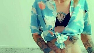 in lingerie, the hot transsexual rubs her clitty while fantasizing about cock and masturbation.