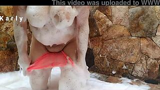 Karlythoth chats casually about her shaved natural tits in a relaxed conversation.