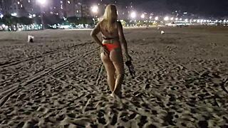 Blonde beach babe flashes tits and pussy in public voyeur scene