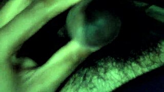 Shemale with big cock performs cumshot with sounding in a wild scene.